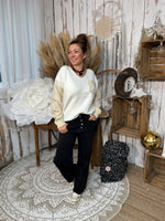 ★ Jean noir wide leg à boutons strassés – Le détail chic qu’on adore