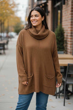 Pull long col roulé